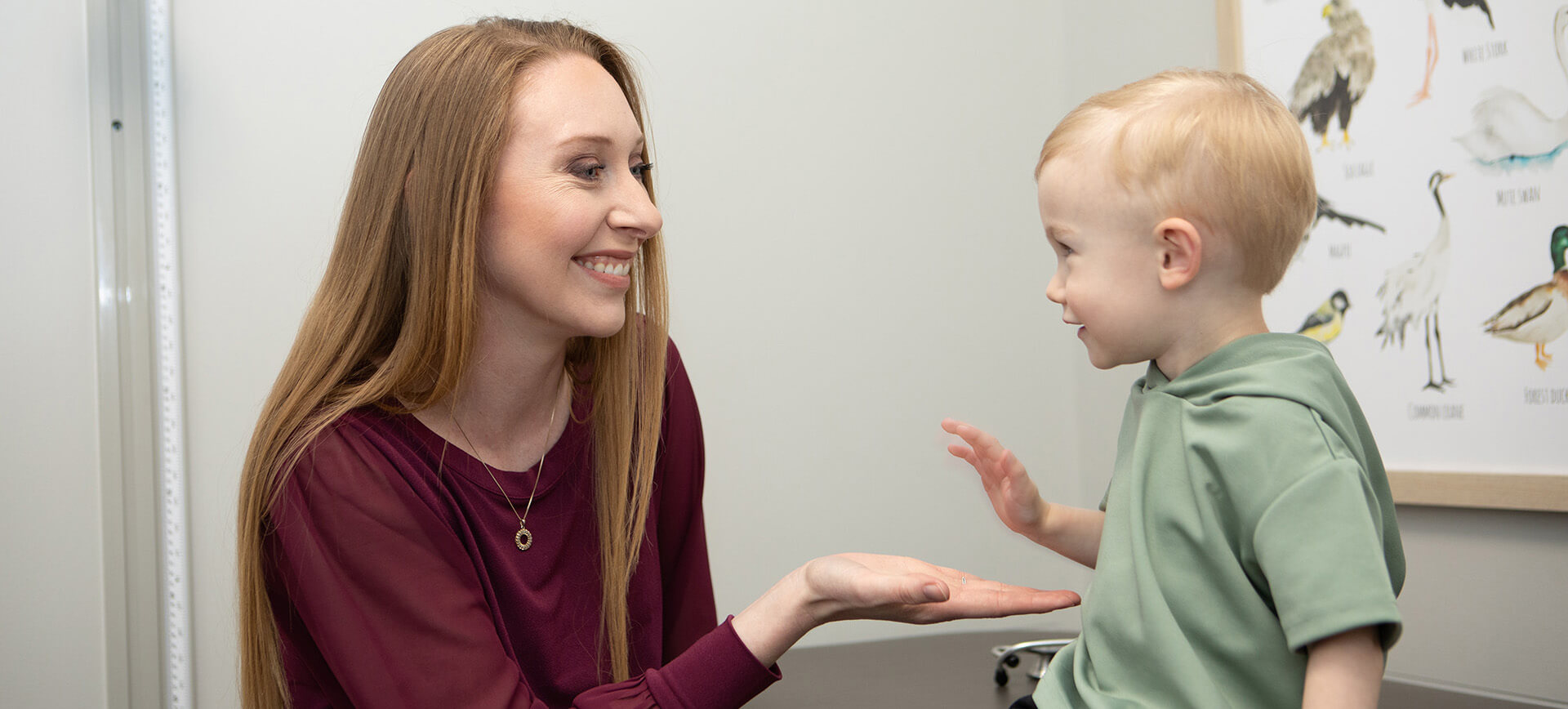 Doctor Playing With Kid In Doctor Office